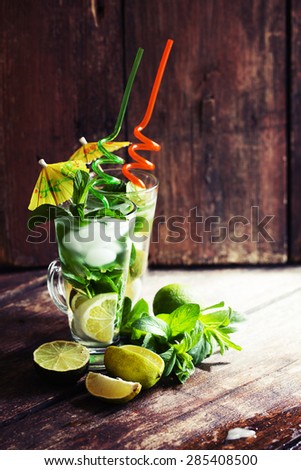 Mojito cocktail and beach in the background/ summer holiday background with two mojito cocktail