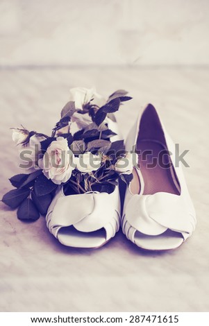 Photo of white shoes and  rose flowers/ WEdding background