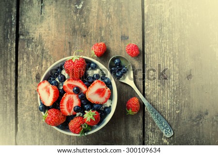 Berries delicious on Wooden Background. Summer Organic Berry over Wood. Agriculture, Gardening, Harvest Concept