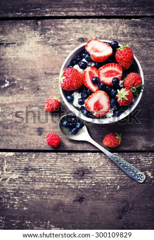 Berries delicious on Wooden Background. Summer Organic Berry over Wood. Agriculture, Gardening, Harvest Concept