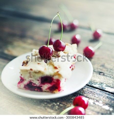 Cherry sponge cake/Cherry cake and slices of cherry cake on rustic wooden background