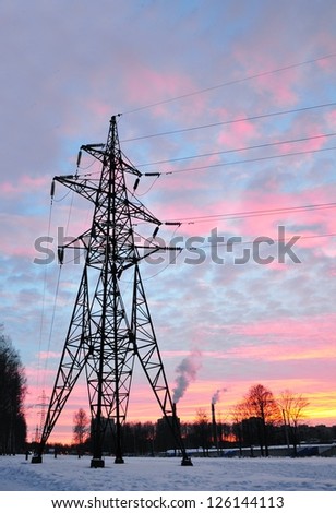 Urban landscape with electric line on sunset