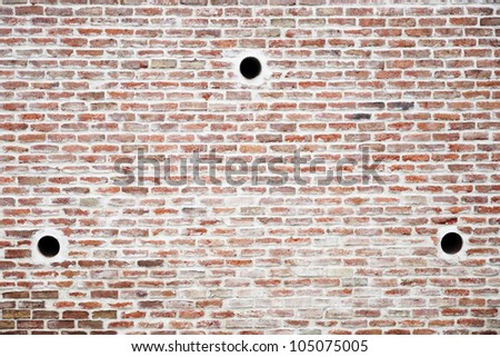 Brick wall texture with water evacuating tubes