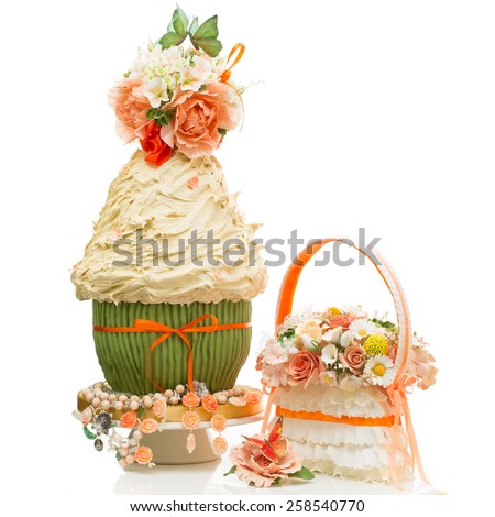 Stylish wedding cake decorated with flowers and bouquet isolated over white background