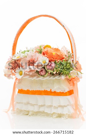 Stylish bridal bouquet made as basket with flowers isolated over white background