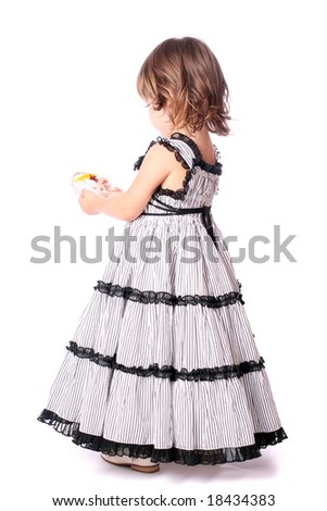 A pretty little girl with a comb in her hand over white background
