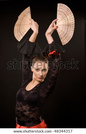Attractive spanish dancer over black background