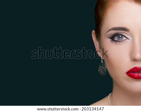 Portrait of beautiful woman with earring. Perfect makeup.