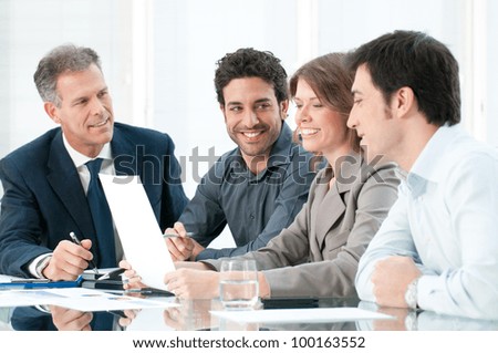 Happy smiling business team working together at office