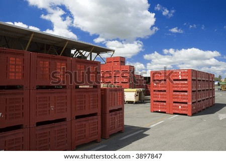 Large red bins ready to be shipped