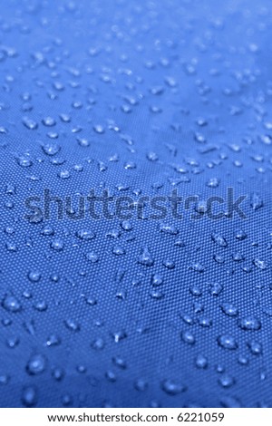 Water drops pattern over a waterproof cloth, blue pattern