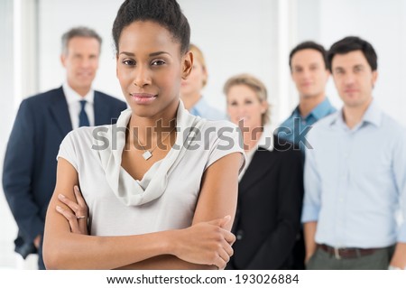 Confident African Businesswoman In Front Of Office Staff