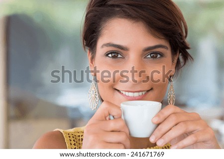 Close Up Of Young Beautiful Woman Holding Cup Of Coffee At Bar