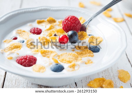 Bowl of milk with cereals and fruit