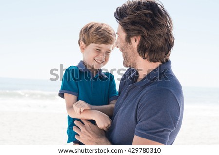 Child in father arms. Father day out with son. Father spending quality time with son.