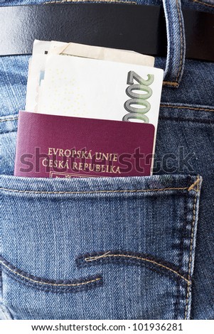 Czech passport with money in the back pocket of woman\'s jeans..