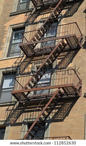 Typical American-style steel fire escapes downtown Manhattan, New York City.