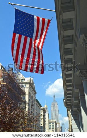 The Stars and Stripes or the american flag with Empire State Building in the background