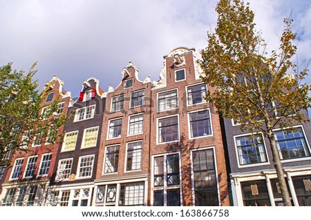 Typical canal houses in Amsterdam which often are slim, high, deep and very old