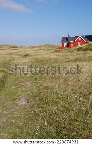 Traditional red danish holiday home on the Island of Romo close to Lakolk and the Wadden Sea