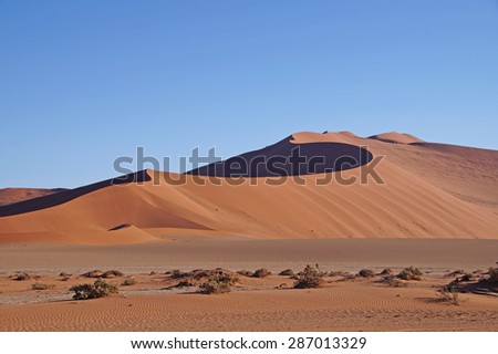 Dry landscape with sand dunes seen in Sossusvlei Park in Namibia