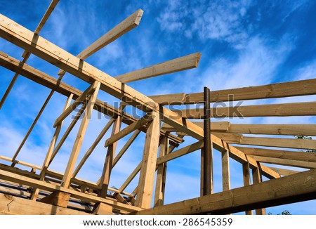 Installation of the roof during the construction frame house