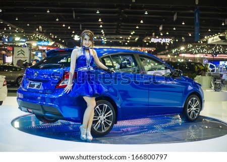 NONTHABURI - DECEMBER 8: Unidentified modellings posted over  The new Proton Suprima S display on stage at The 30th Thailand International Motor Expo on December 8, 2013 in Nonthaburi, Thailand.