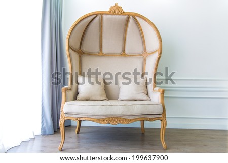 Antique armchair in white room with curtain background