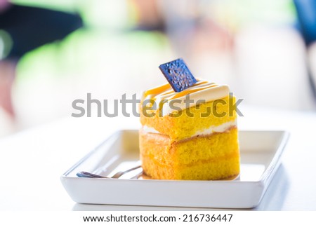 A piece of honey cake. Slice of layered honey cake.