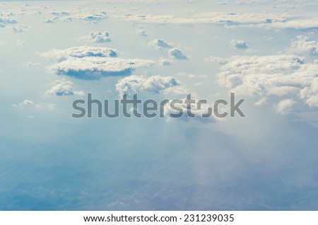 Blue sky with clouds, shot from an airplane. The upper layers of the atmosphere.