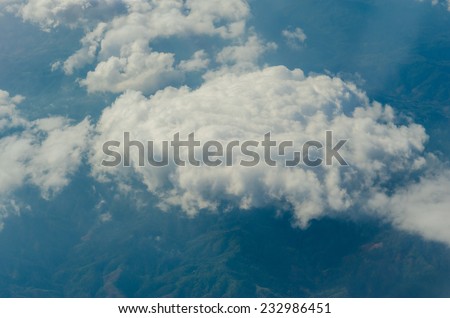 Blue sky with clouds, shot from an airplane. The upper layers of the atmosphere.