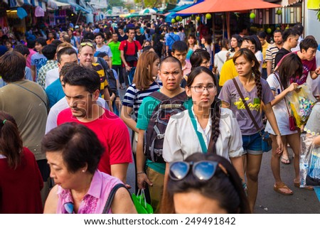 BANGKOK - JAN 25: Tourists and locals shop at Chatuchak Weekend Market January 25, 2015 in Bangkok, Thailand. The Thai capital\'s Chatuchak is the world\'s largest  street markets with 15,000 stalls.