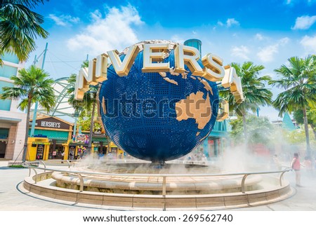 SINGAPORE - MARCH 6: Tourists and theme park visitors taking pictures of the large rotating globe fountain in front of Universal Studios on MARCH 6, 2015 in Sentosa island, Singapore