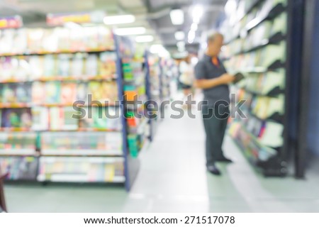 Abstract blurred people walking in book store, Blur image of bookstore