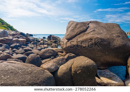 Rock beach and blue sky with beautiful clouds tropical sea,  Rocks at natural bay