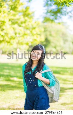 Woman in park outdoor with knapsack, Beautiful woman in the park