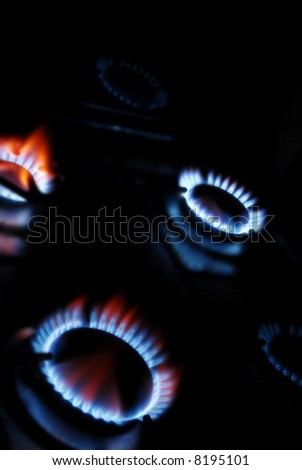 Blue gas flames in the kitchen