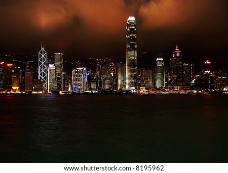 Hong-Kong financial district by night. All skylines are illuminated. Behind Victoria Peak.