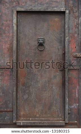 Old, rusty, heavy iron door.