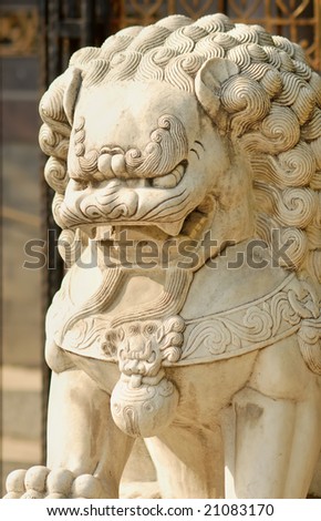 Traditional lion sitting in the front of the house gate