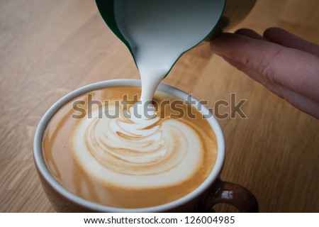 Coffee Pouring By A Barista, Uk.