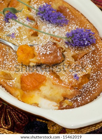 close up of freshly baked peach clafouti. French Custard pie.