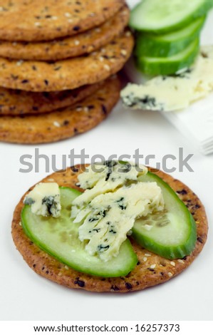 cracker, stilton cheese and cucumber sandwich