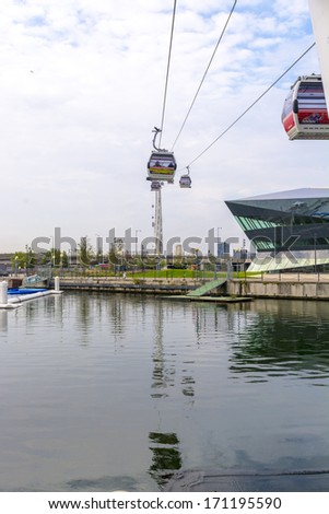 LONDON - SEPT 29: Emirates Air Line cable cars. The service is the UK\'s first urban cable car running across the Thames from the O2 to the Excel Center September 29, 2013 in London UK .