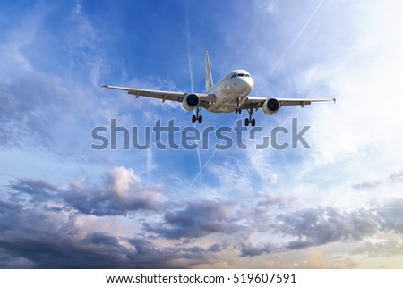 Passenger plane take off from runways against beautiful cloudy sky.