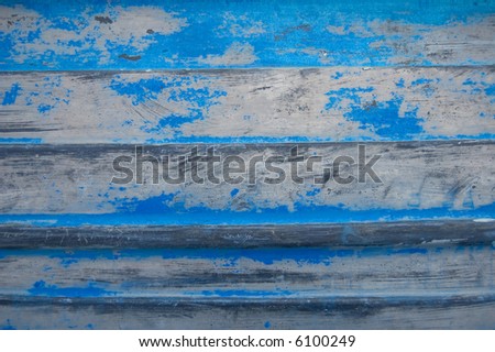 Blue weathered and textured hull of a boat