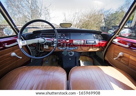 Old 1970s French car Citroen interior - panel drive - in red.