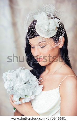 Bride portrait with make-up and gorgeous hair ornaments - a white rose.