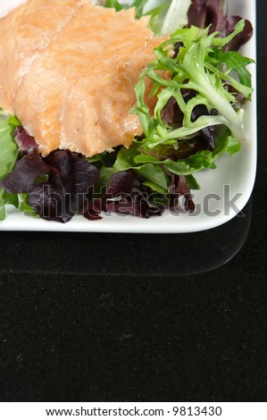 Alaskan smoked sockeye salmon starter on a bed of lettuce