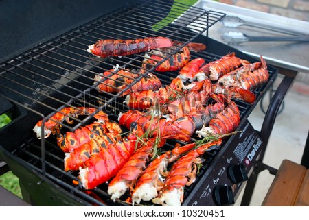 Image of lobsters being roasted on a grill